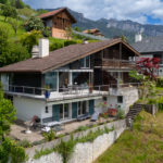 Ferienwohnung Fotografie - Haus mit Sicht auf den Thunersee im Berner Oberland, Schweiz.